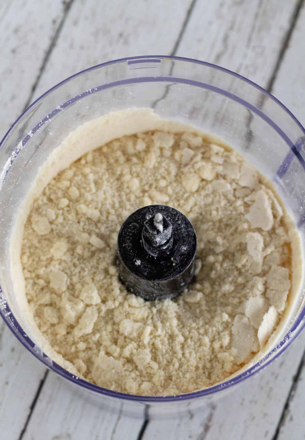 dry ingredients with butter in food processor