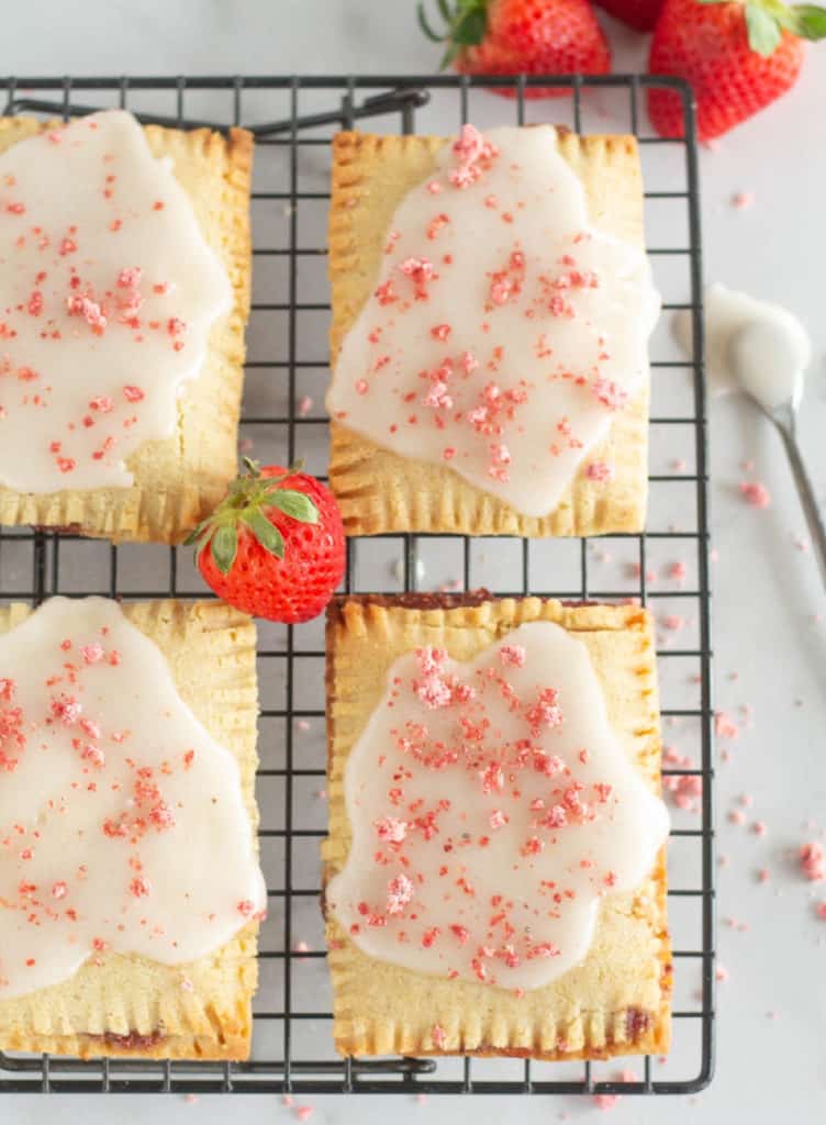 overhead shot of keto pop tarts on cooling rack with strawberries