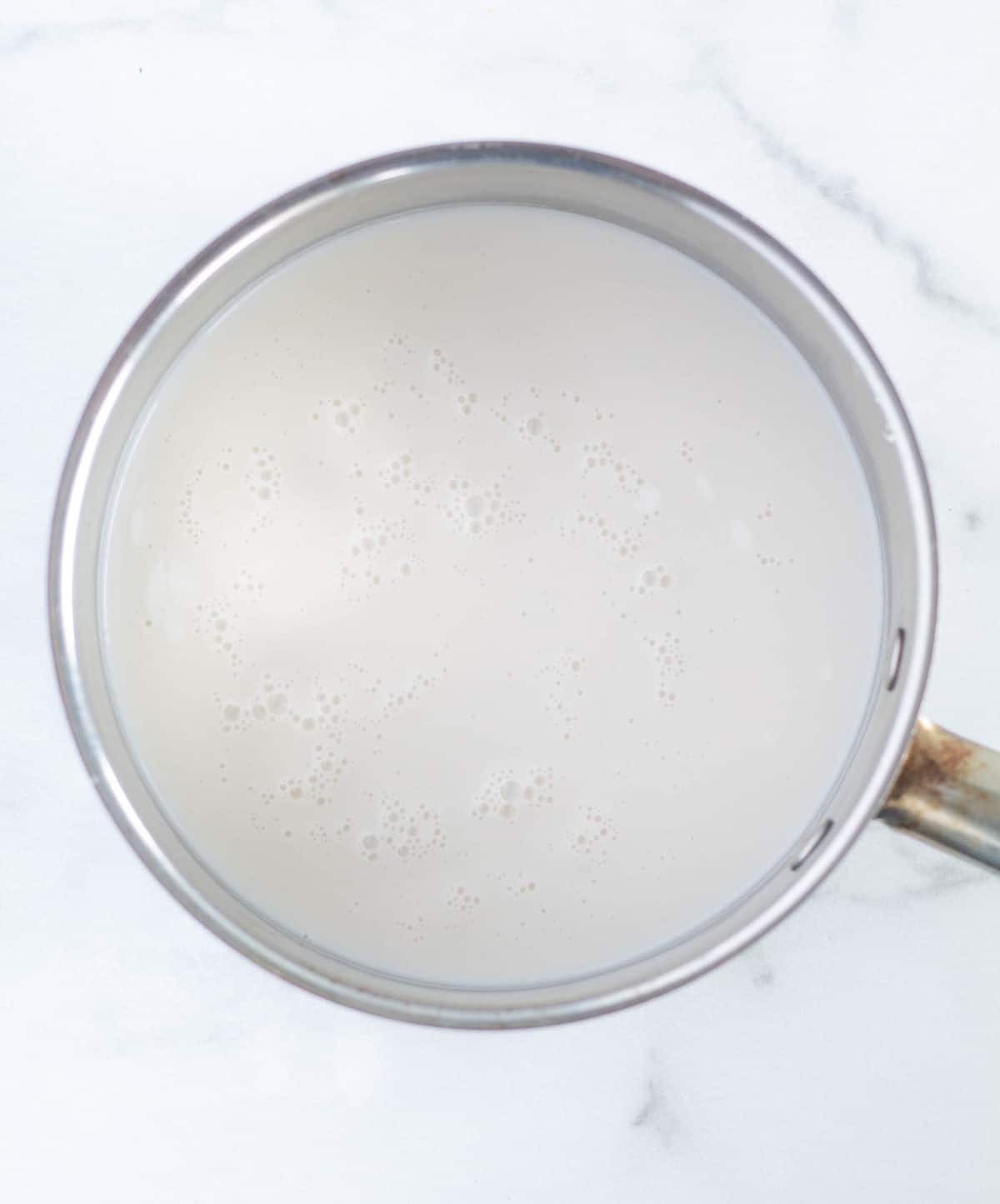 warmed milk in saucepan