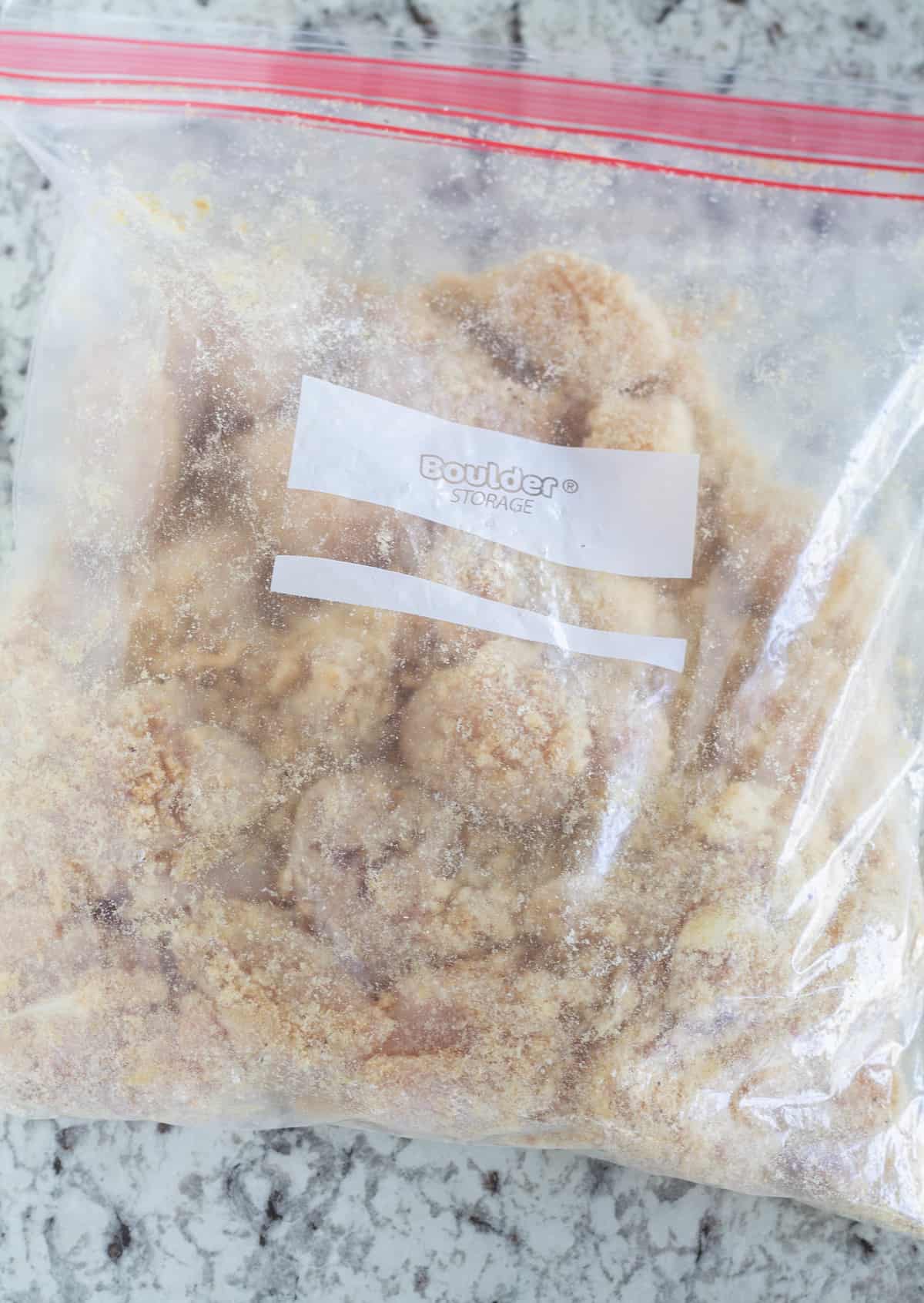 Breaded chicken in plastic baggie.