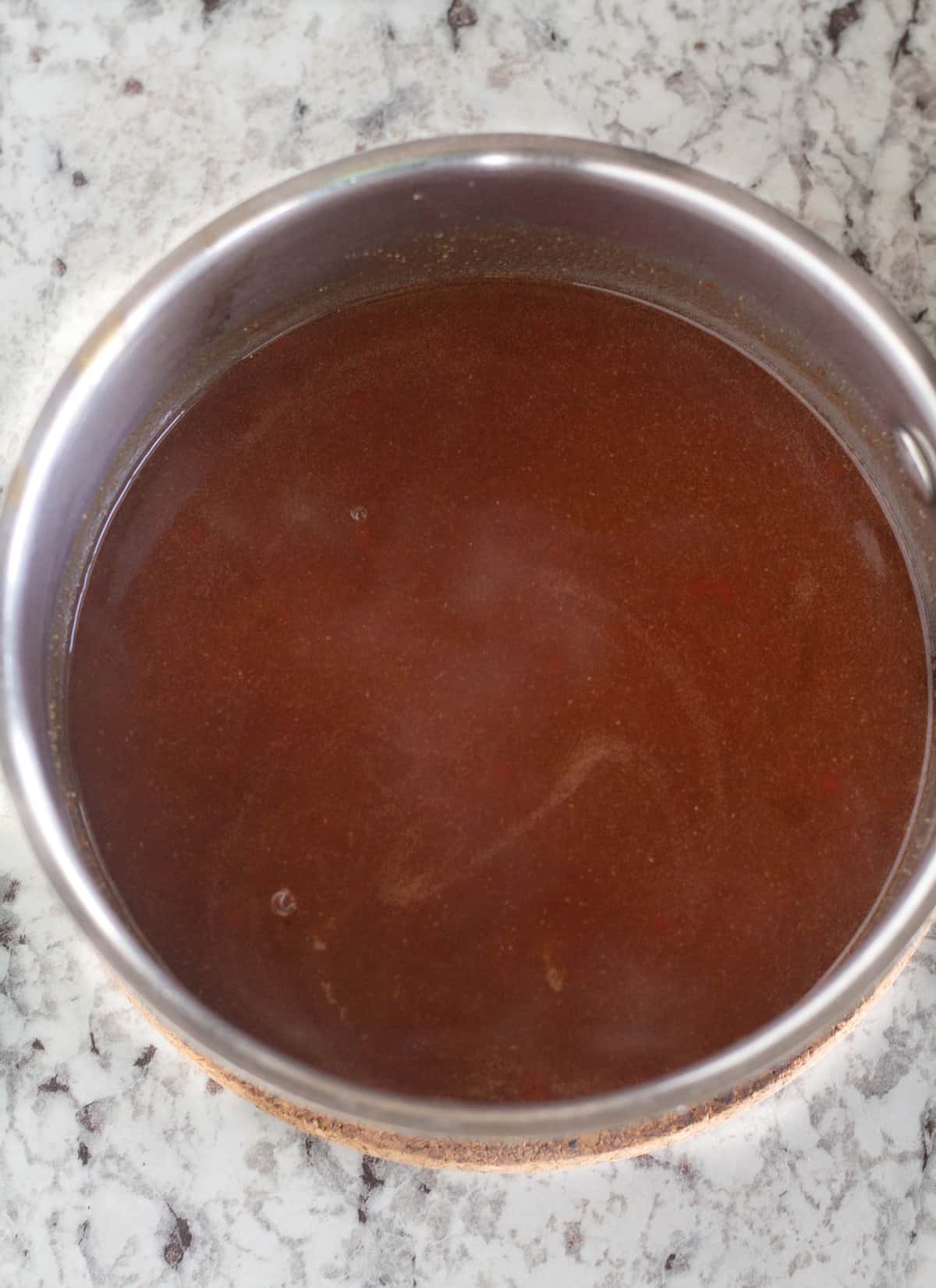 The sweet and sour sauce in a pan.
