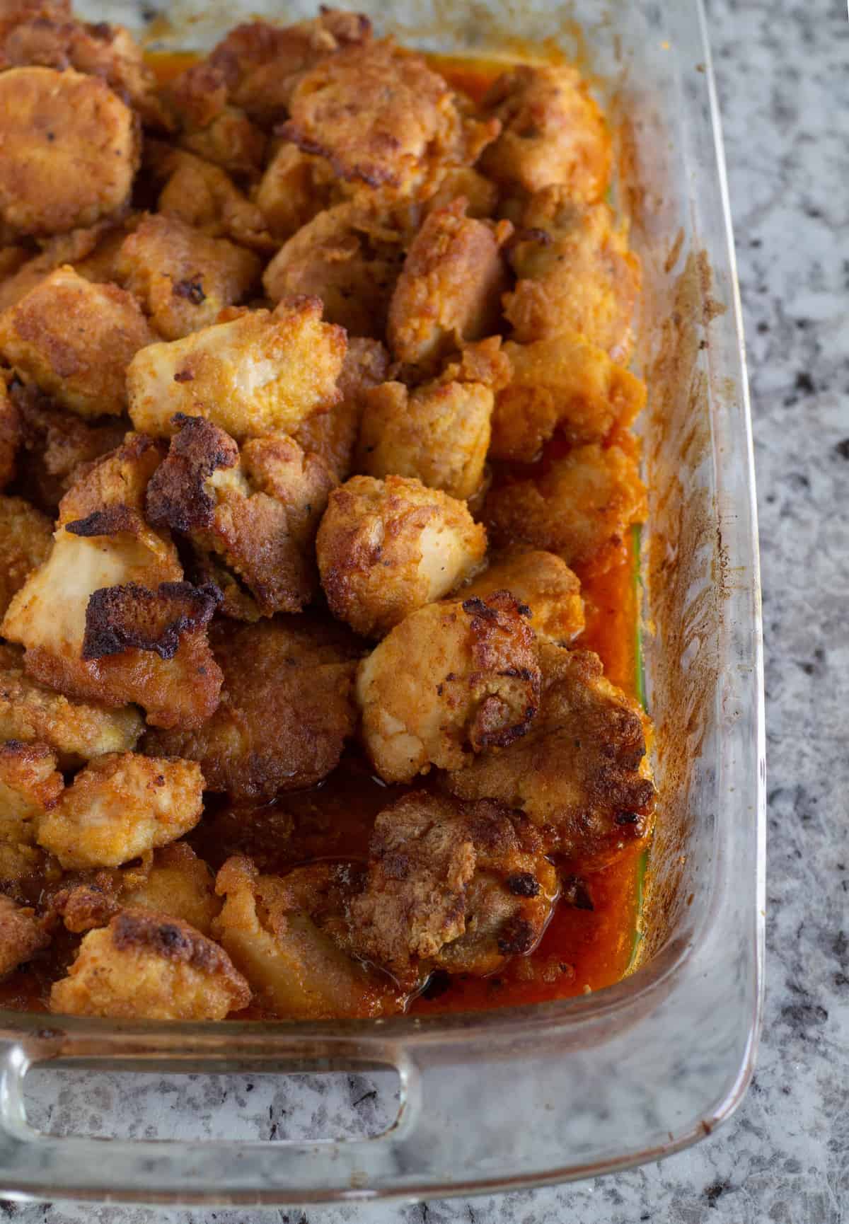 Baked sweet and sour chicken in large baking dish