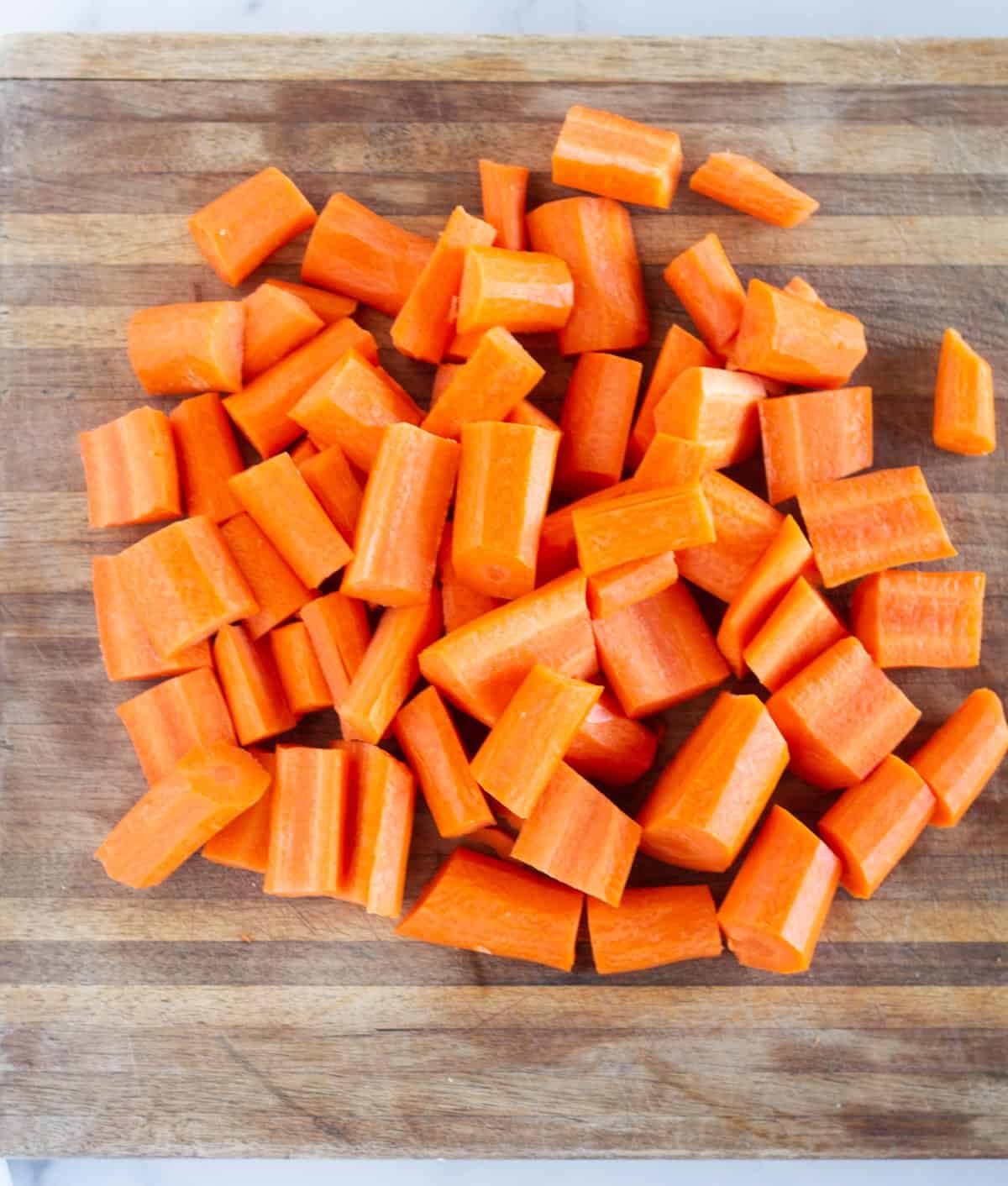 chopped carrots on cutting board.