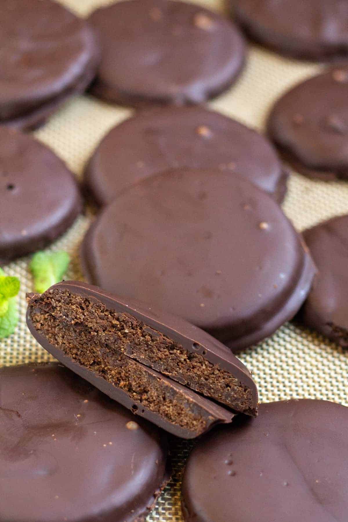 Thin mints on silpat lined baking sheet with one cut in half