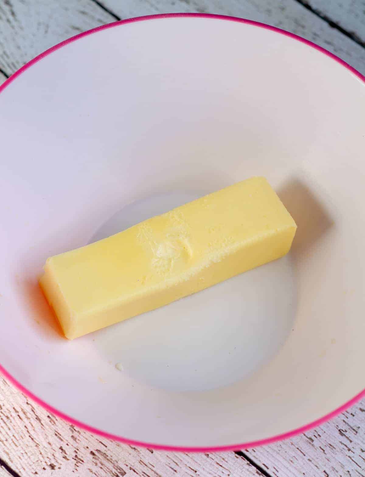 softened butter in bowl