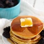 pancakes with butter, syrup, and blackberries