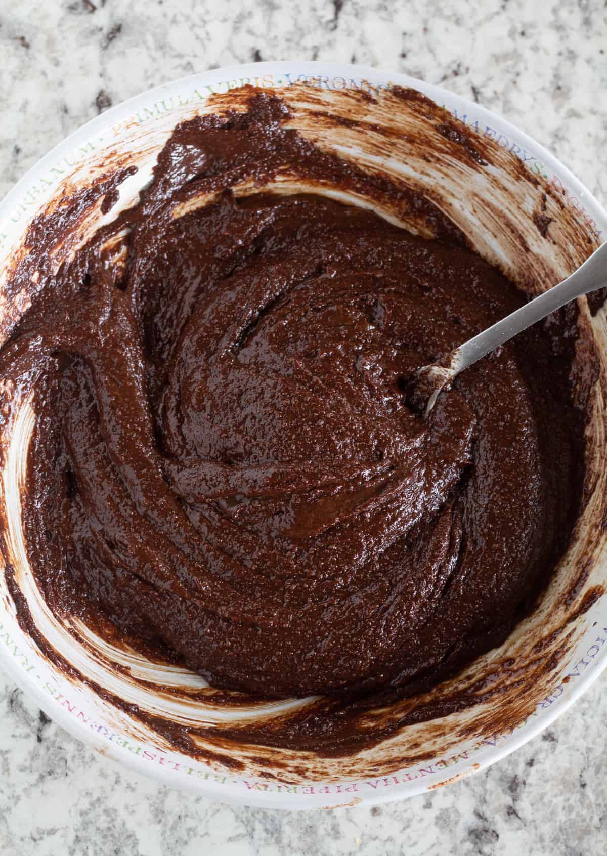 brownie batter in bowl with spoon