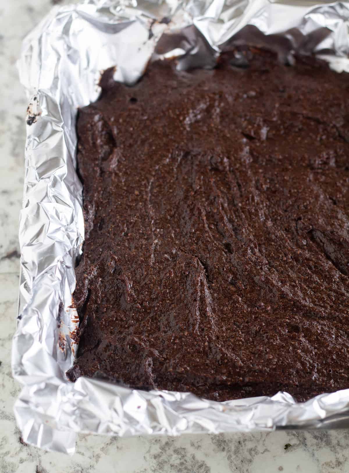 Uncut, baked brownies in pan