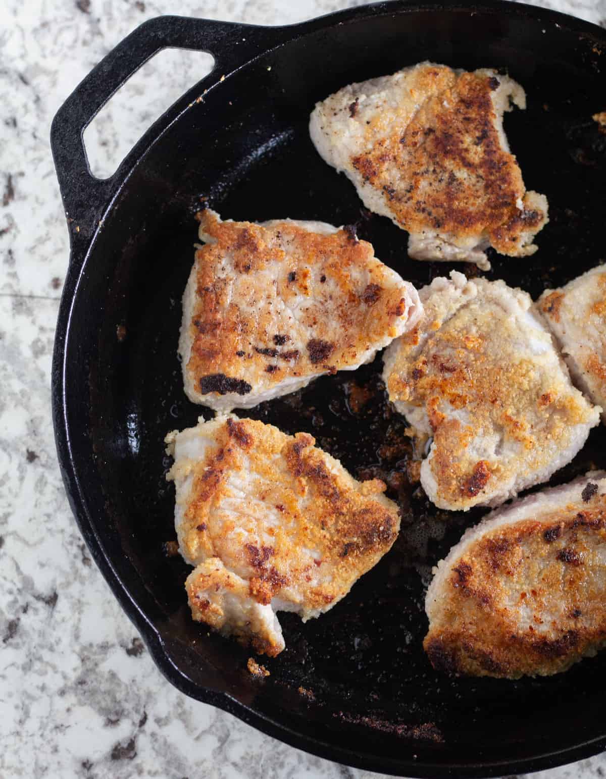 browned medallions in cast iron skillet.