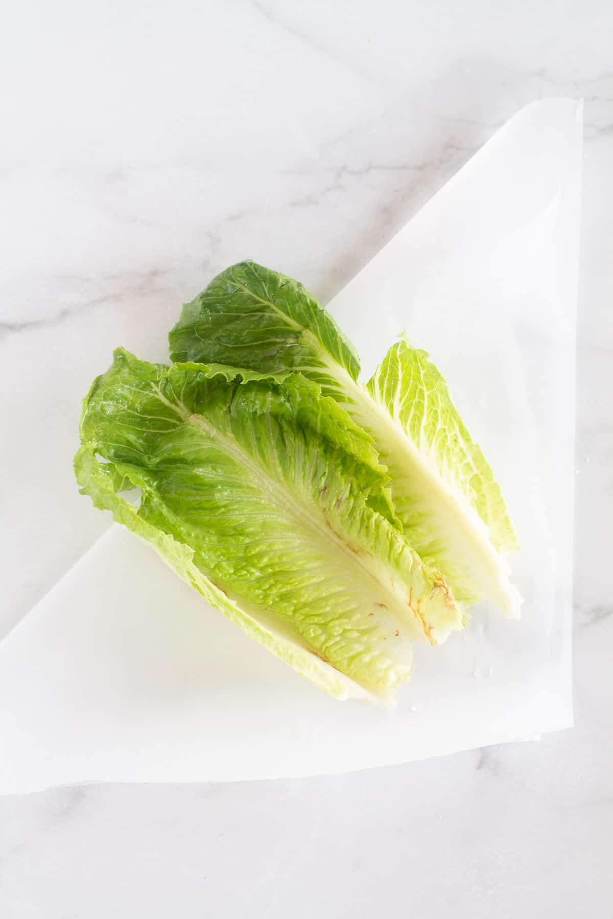 lettuce leaves on parchment paper