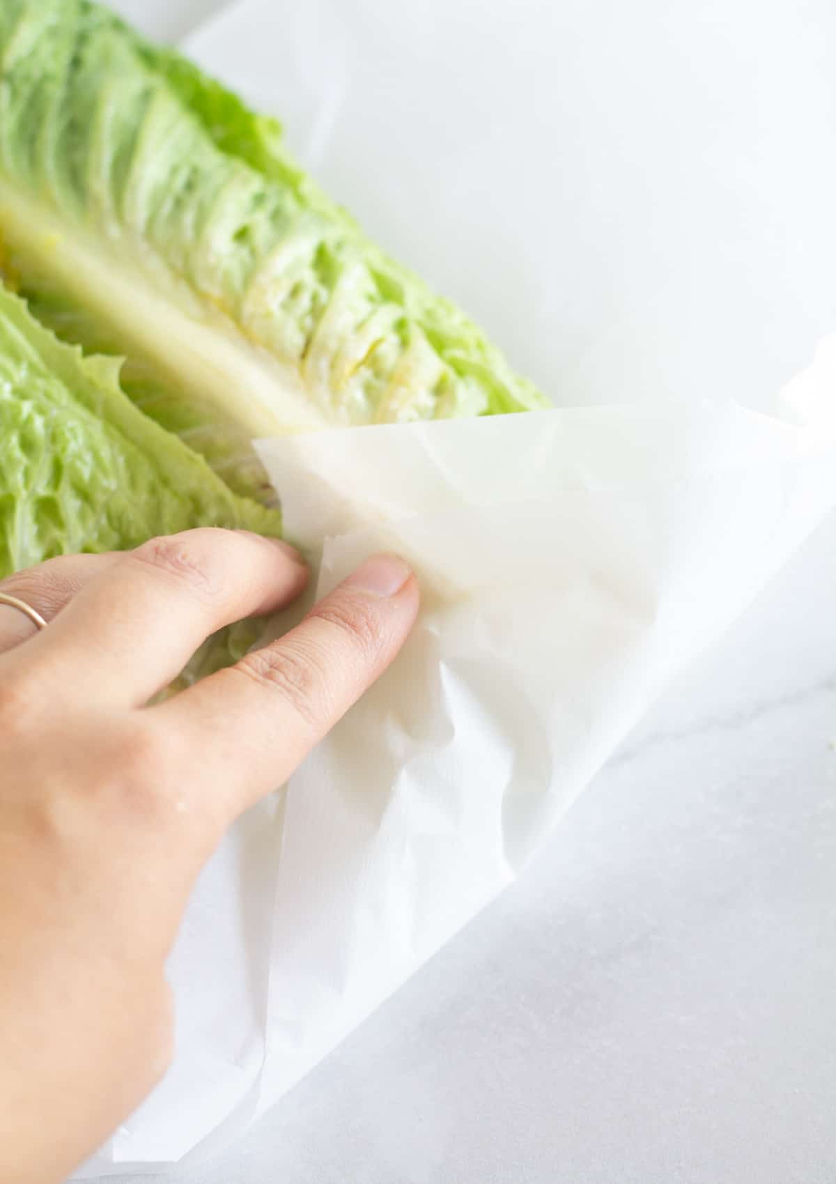 folding the bottom corner up over the lettuce