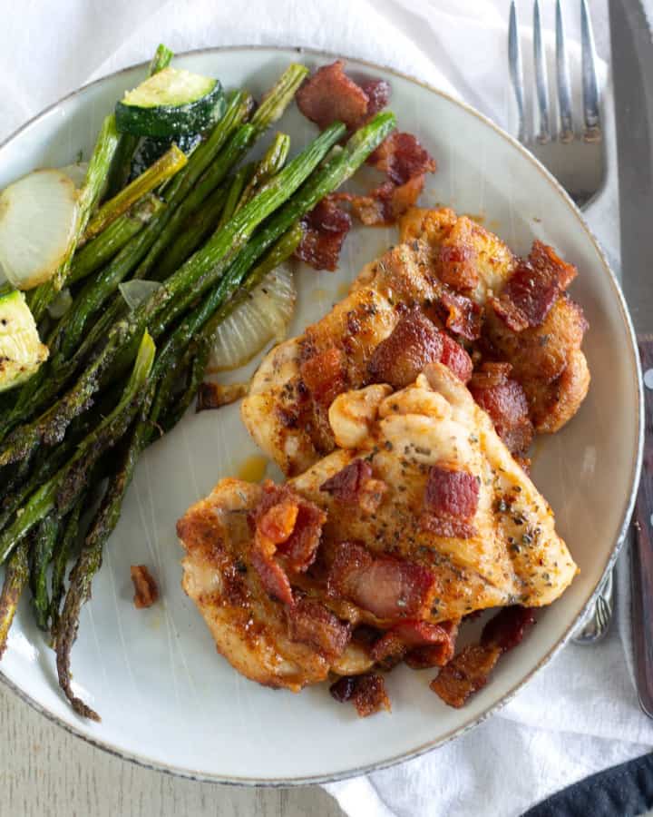 overhead shot of keto chicken and bacon with asparagus