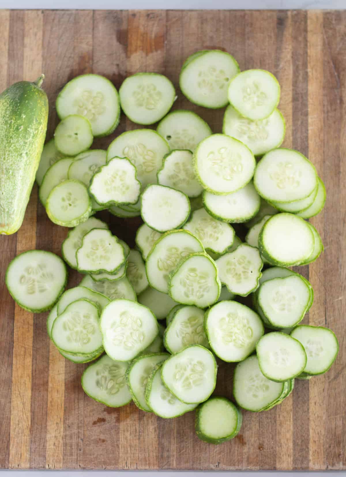sliced cucumber on a cutting board