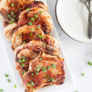 overhead shot of low carb pork chops with cherry glaze on platter