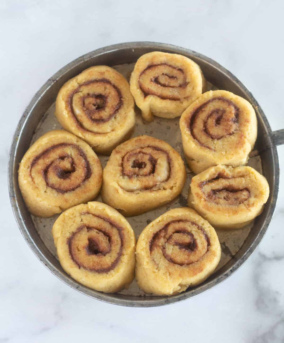 unbaked cinnamon rolls after rising 1 hour