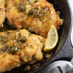 close up of keto & whole30 chicken piccata in cast iron skillet