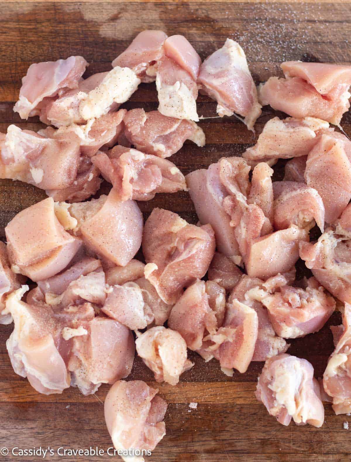 chopped chicken on cutting board.