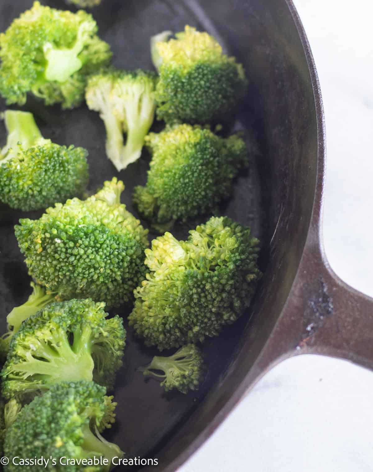 steamed broccoli in a skillet.