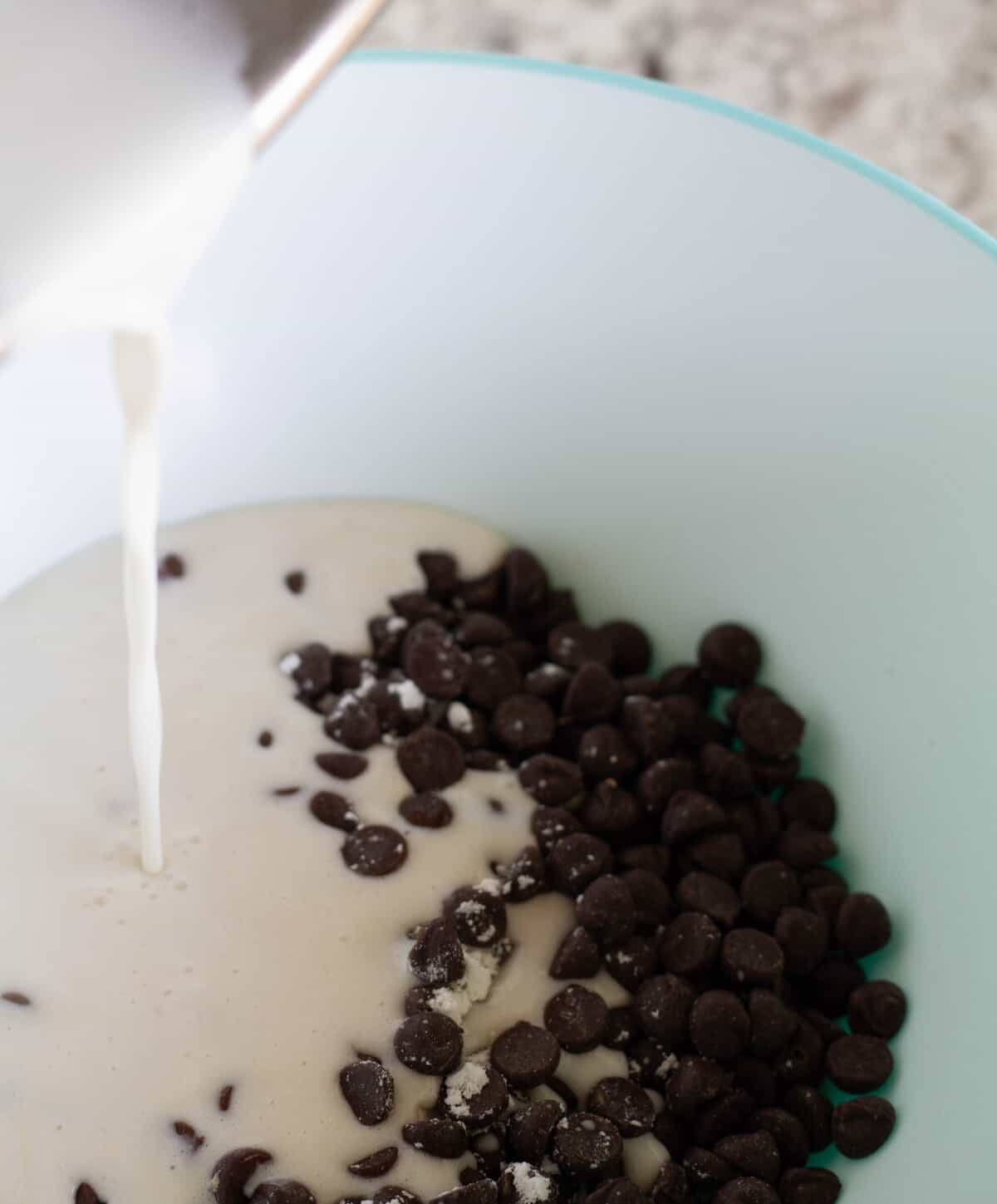 Pouring cream over chocolate chips.