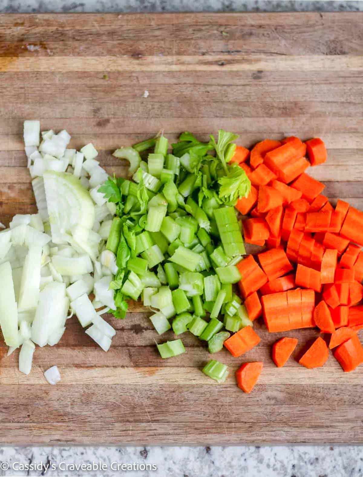 chopped veggies on wooden cutting board