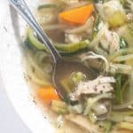 close up of soup in a bowl with a spoon