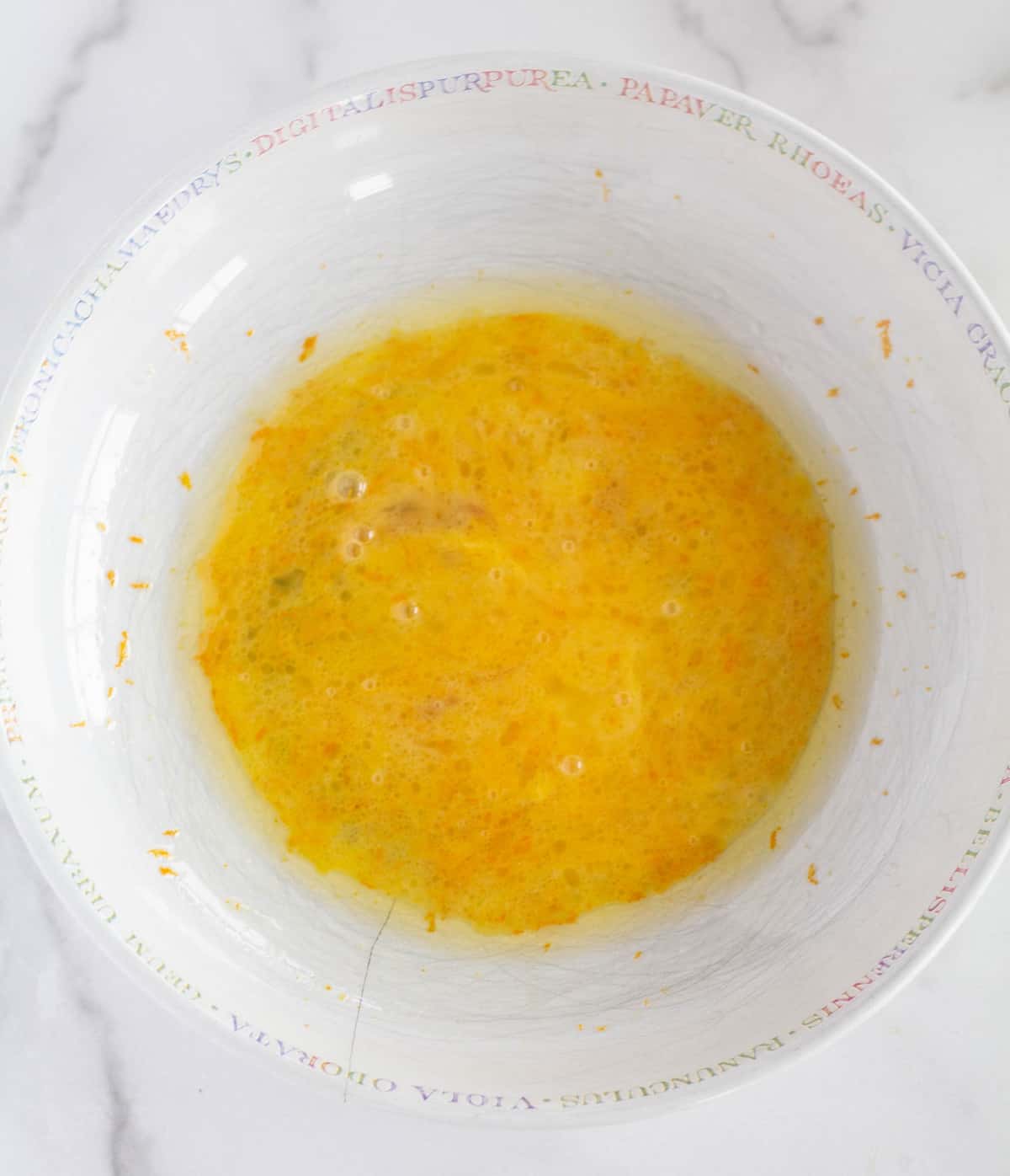 wet ingredients in white mixing bowl