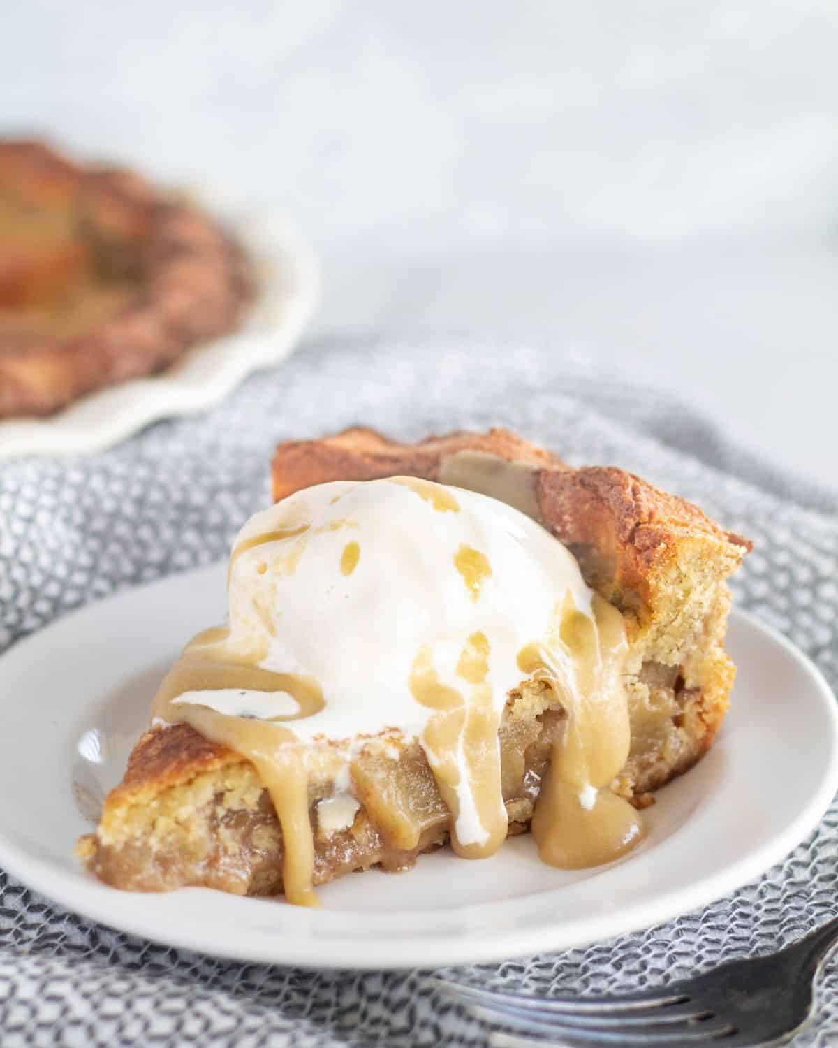 close up of apple pie with caramel and ice cream.