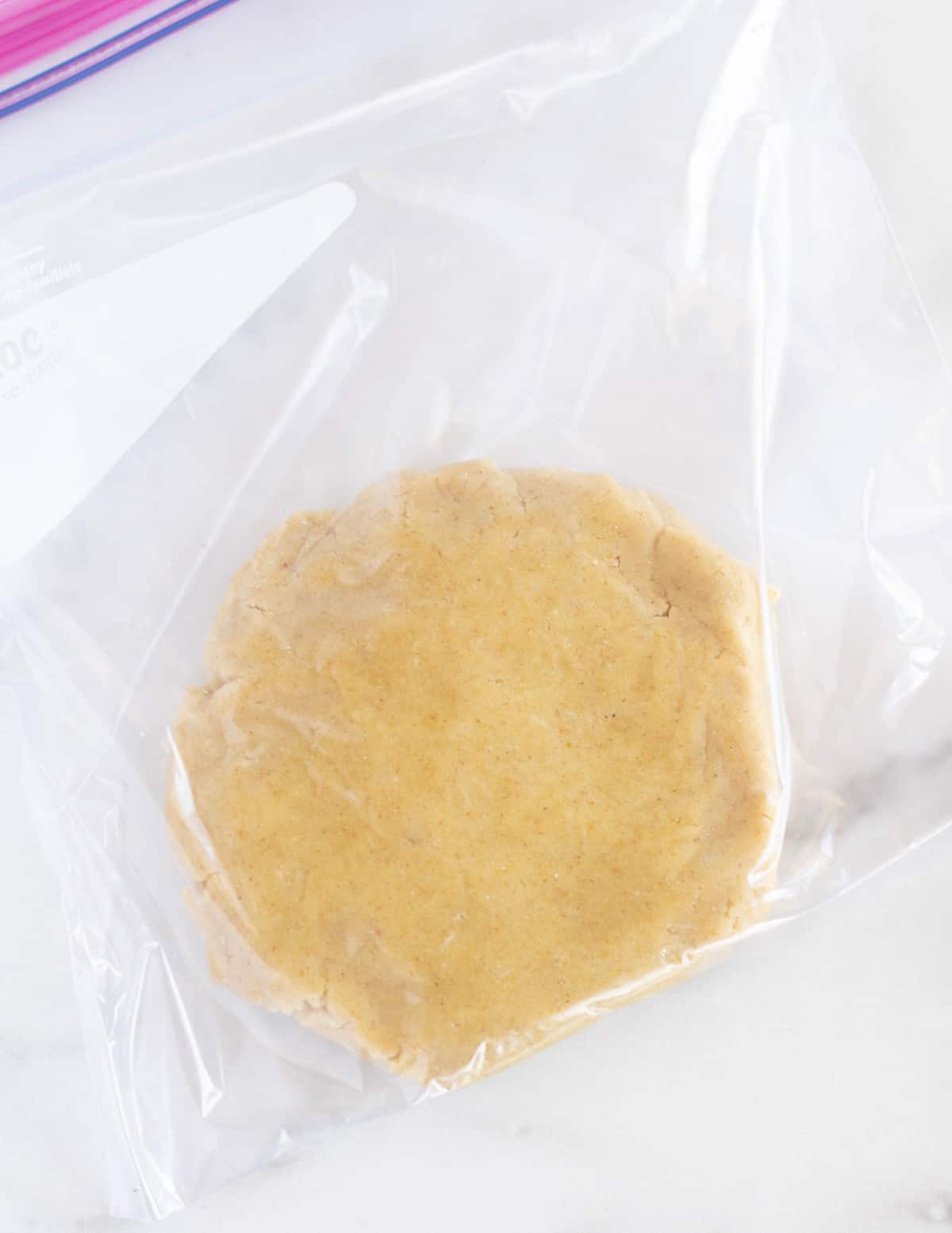 unbaked pie dough in a plastic baggie