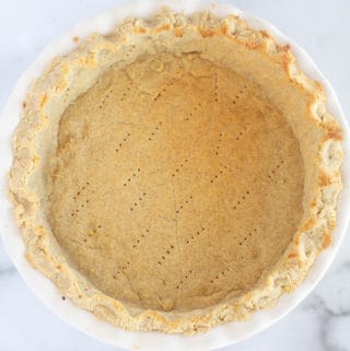overhead shot of unfilled, baked keto pie crust