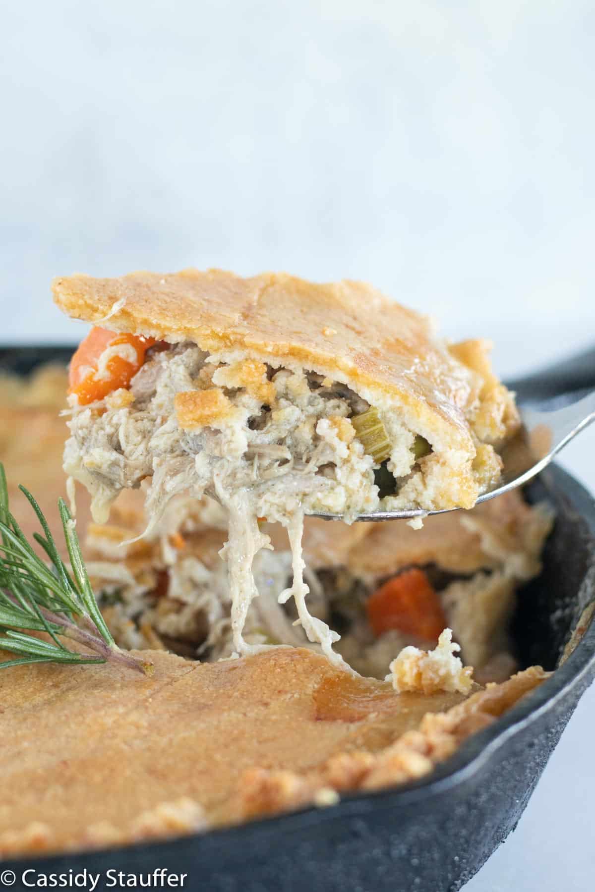 scooping out chicken pot pie