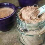scooping hot chocolate mix out of container