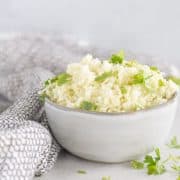 square image of cauliflower rice in a bowl.