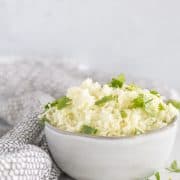 cauliflower rice in small bowl with parsley