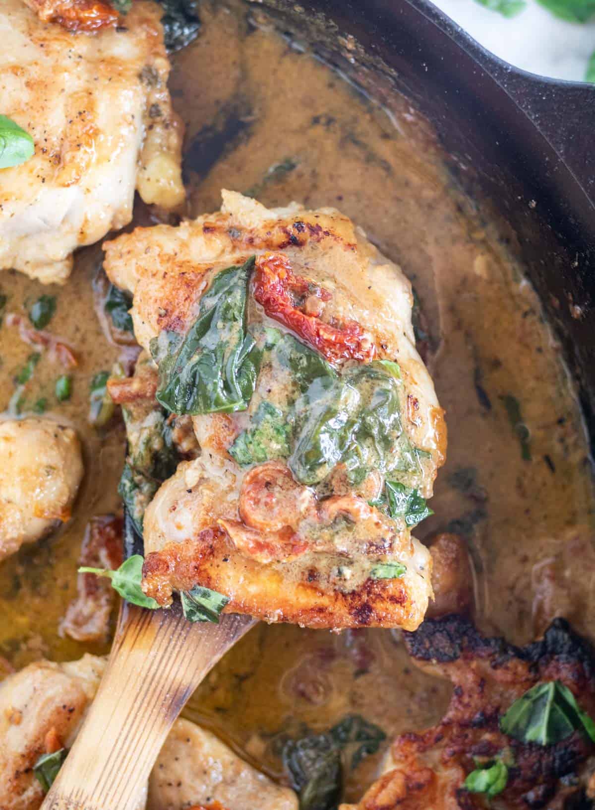 close up of tuscan chicken in skillet