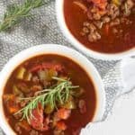 hamburger soup in bowls with title of recipe at the top