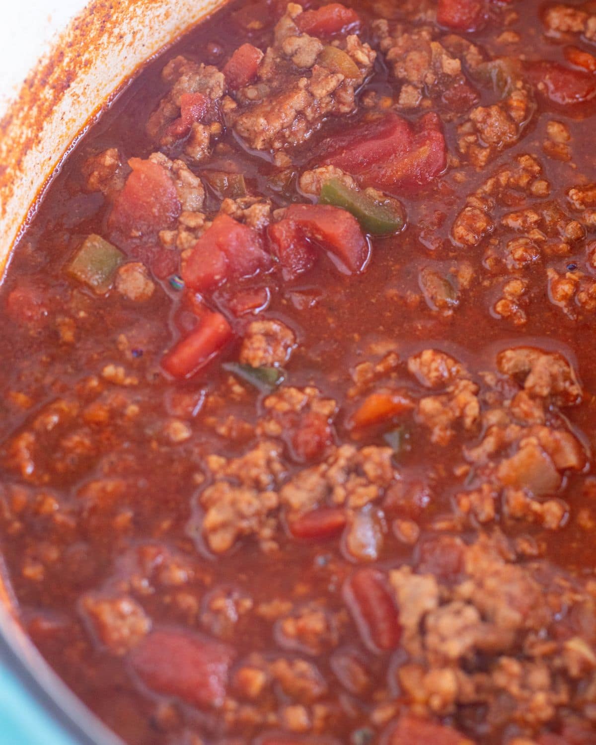 chili simmering in a large pot.