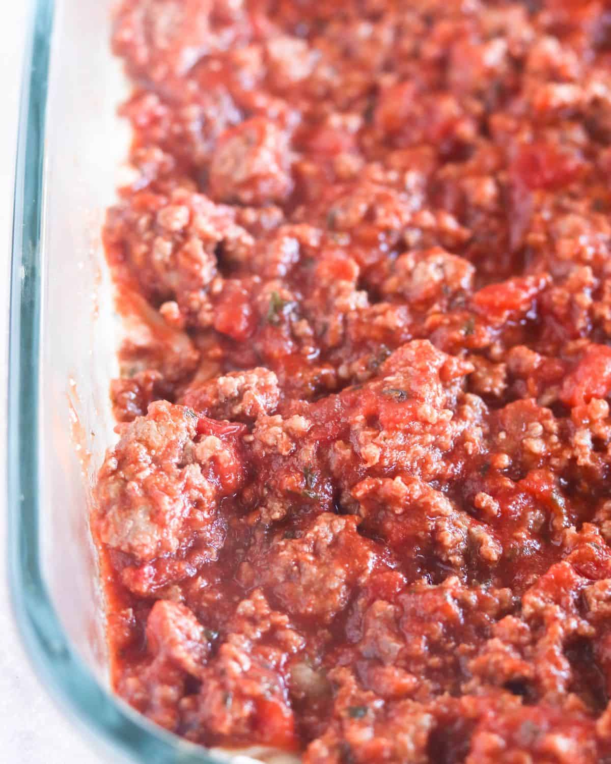 meat sauce layer over the mozzarella cheese.