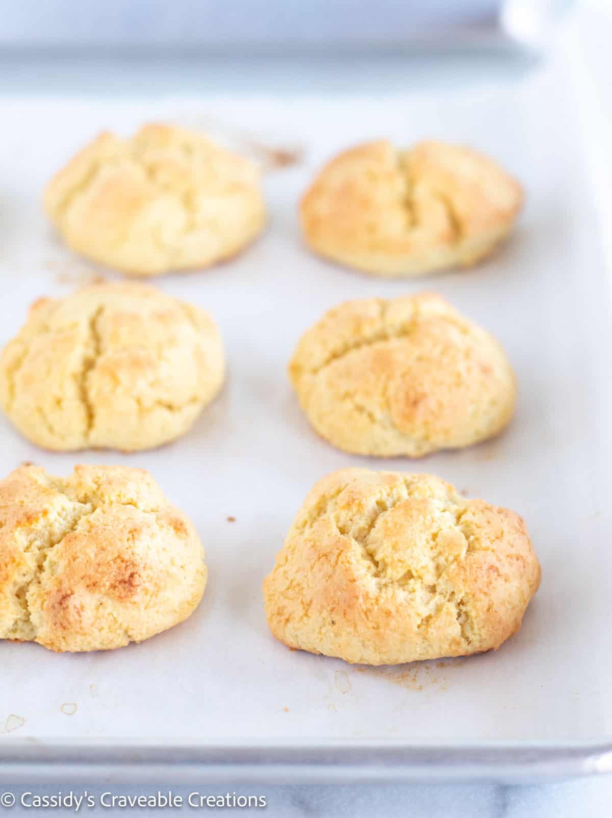 baked biscuits on baking sheet.