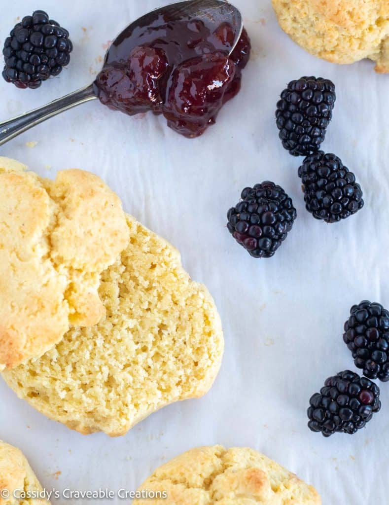 cut biscuit on parchment paper with berries
