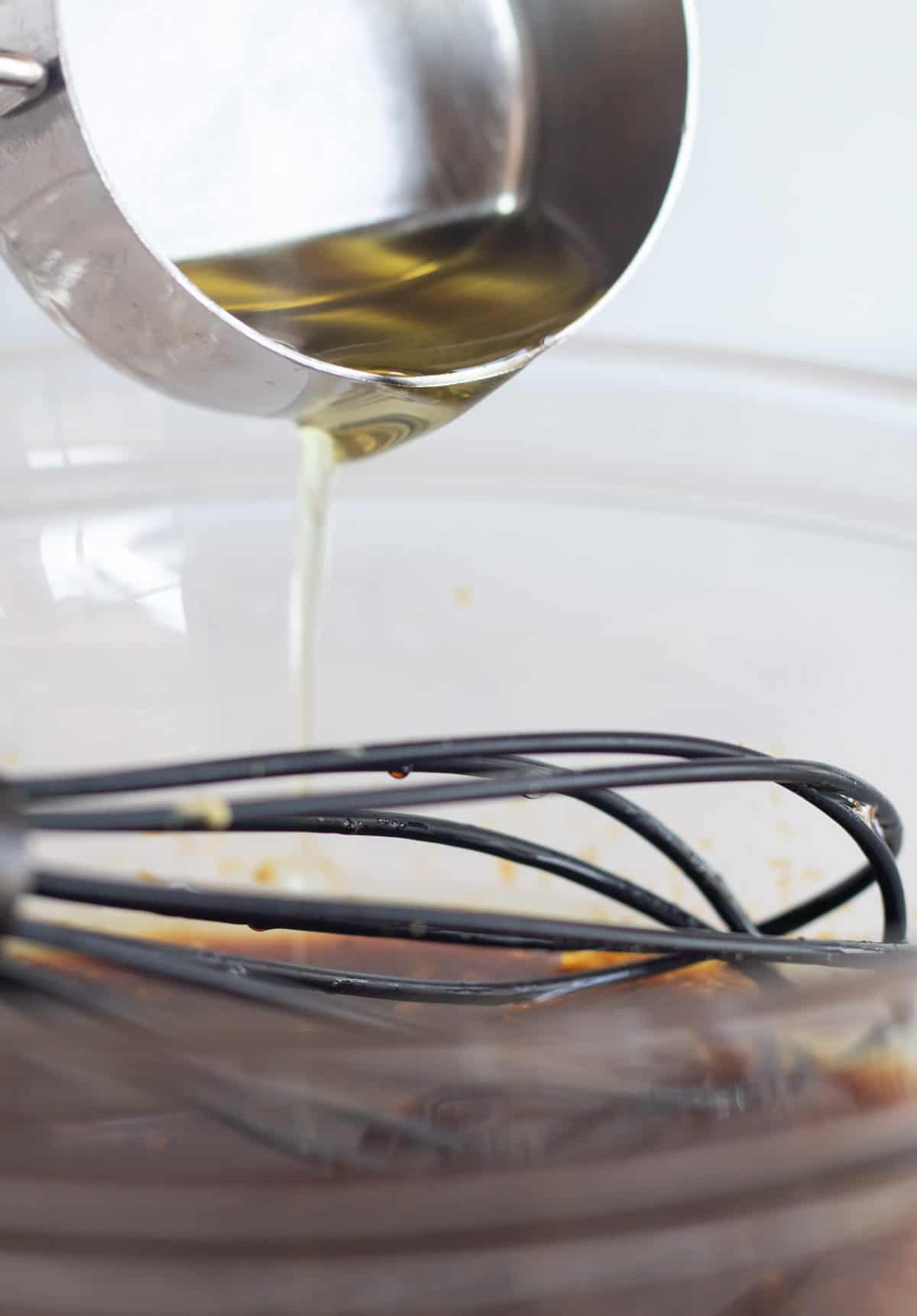 whidking oil into vinaigrette