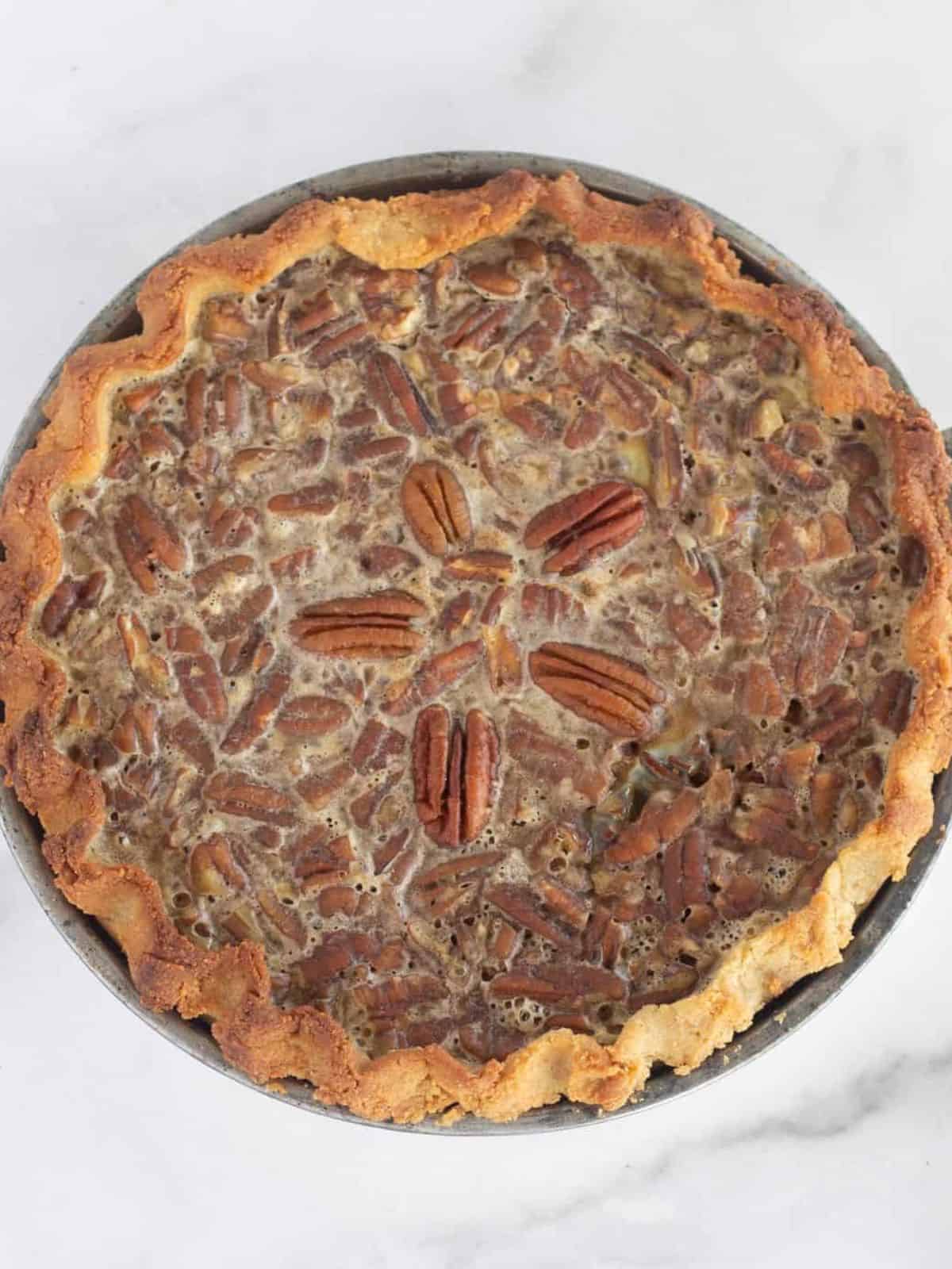 Overhead view of a baked sugar-free pecan pie.