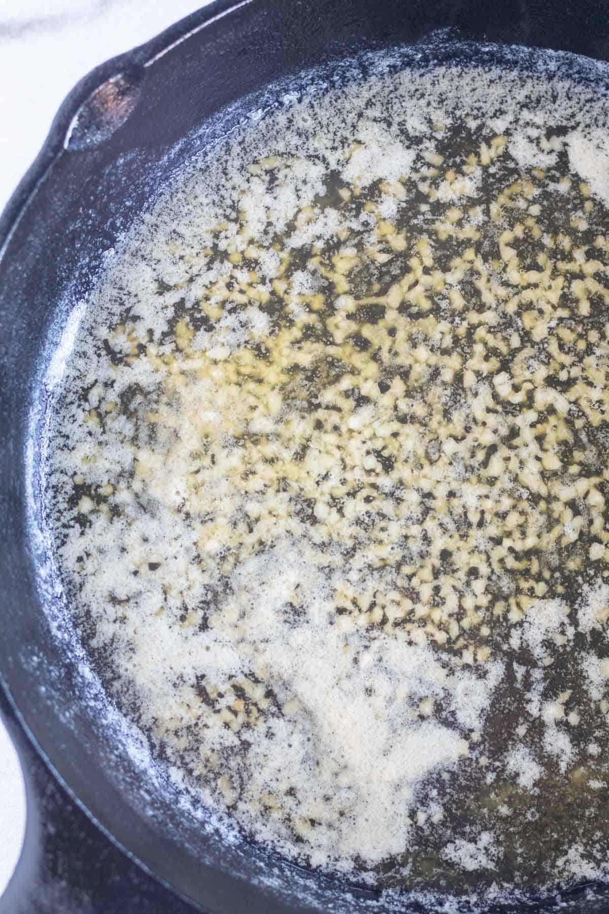 butter and garlic in cast iron skillet