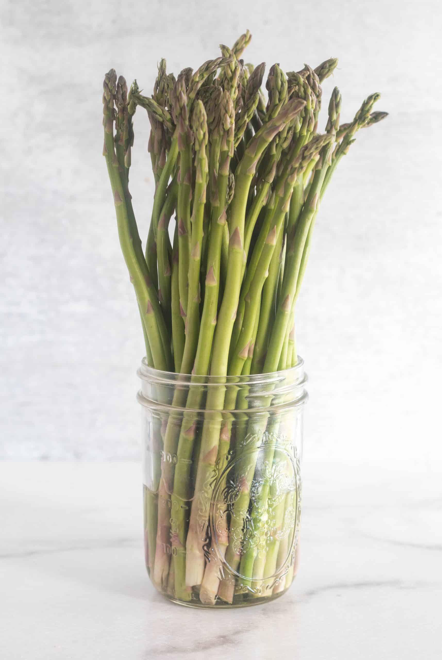 asparagus in a mason jar with water