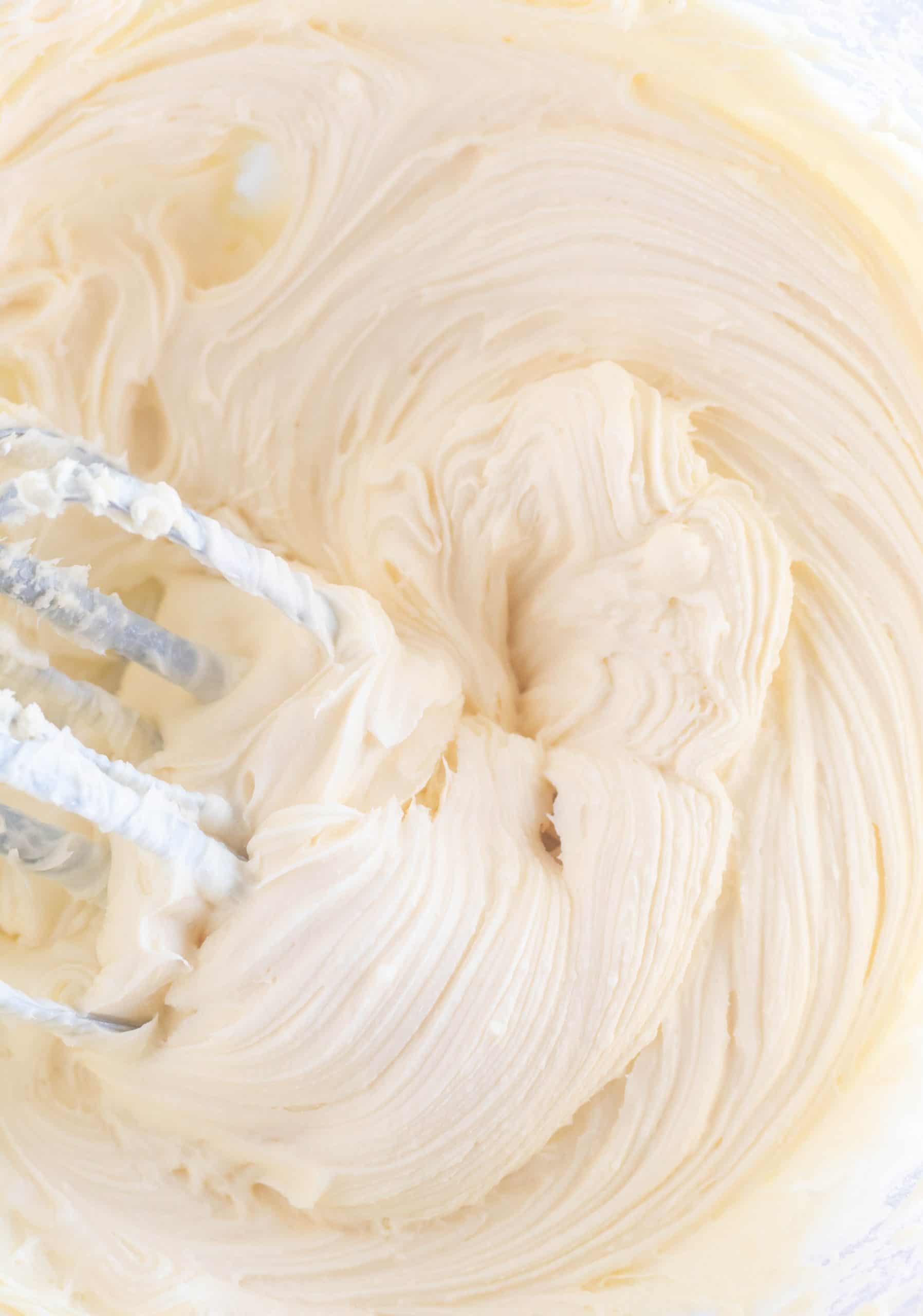 cream cheese frosting in a large bowl with beaters
