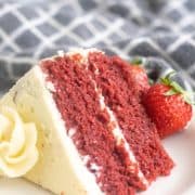 keto red velvet cake on a white plate with strawberries
