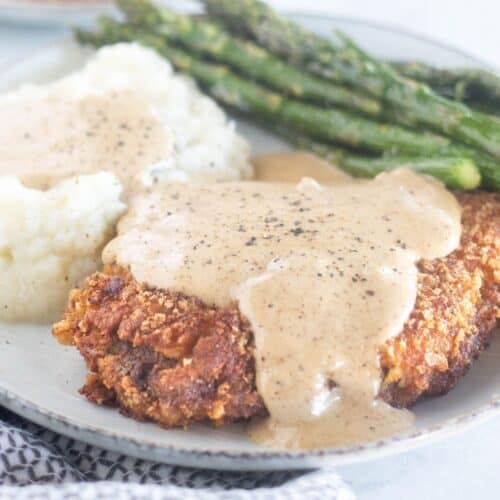 square image of plated chicken fried steak with gravy