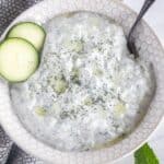 tzatziki sauce in a bowl with the name of the recipe at the top