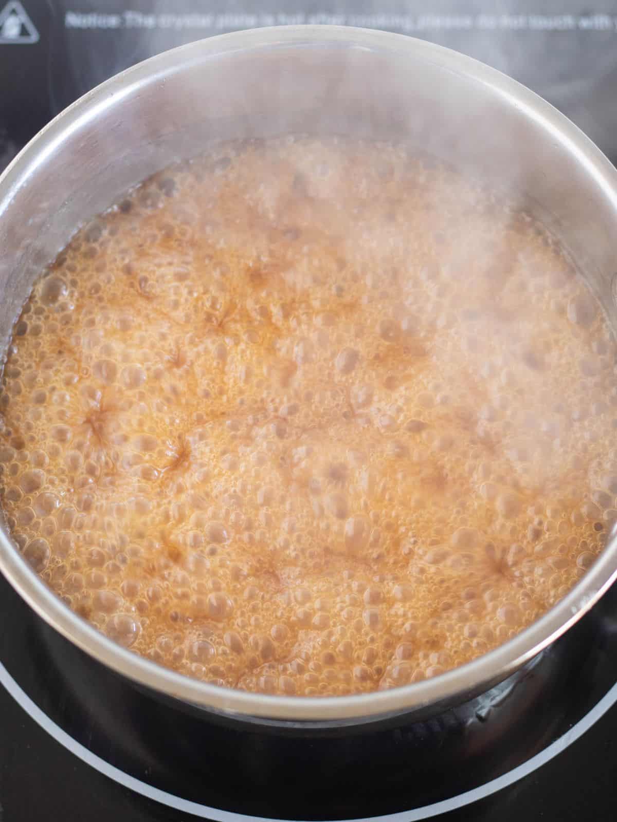 butter/sweetener mixture boiling in a saucepan.