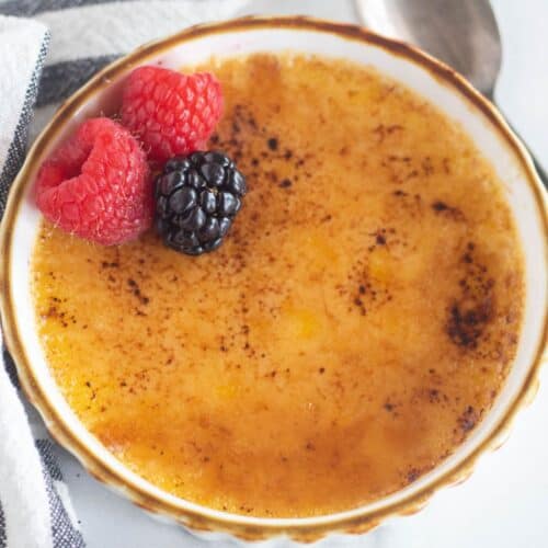 close up of keto cream brulee with berries.