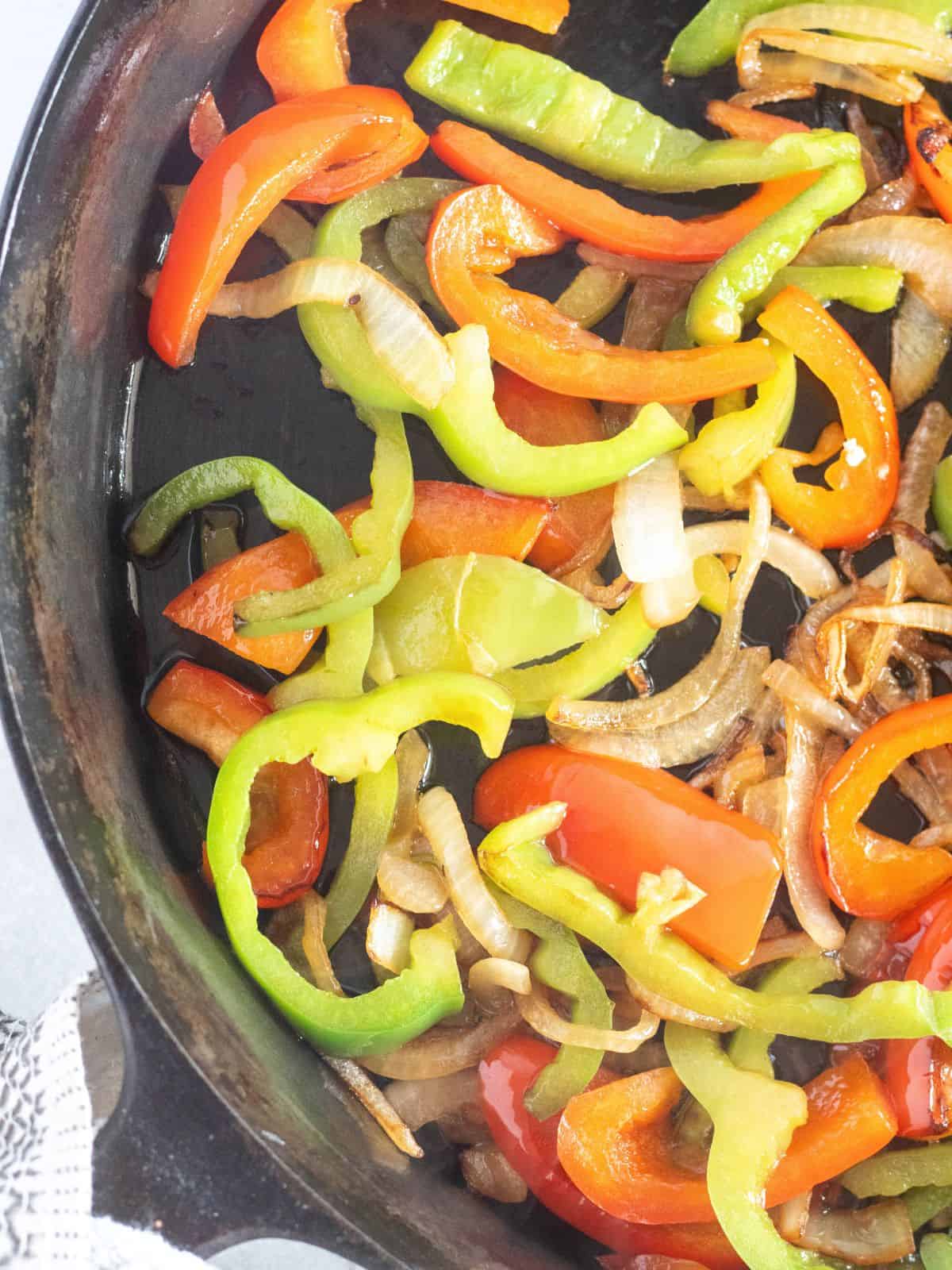 sauteed peppers and onion in cast iron skillet.